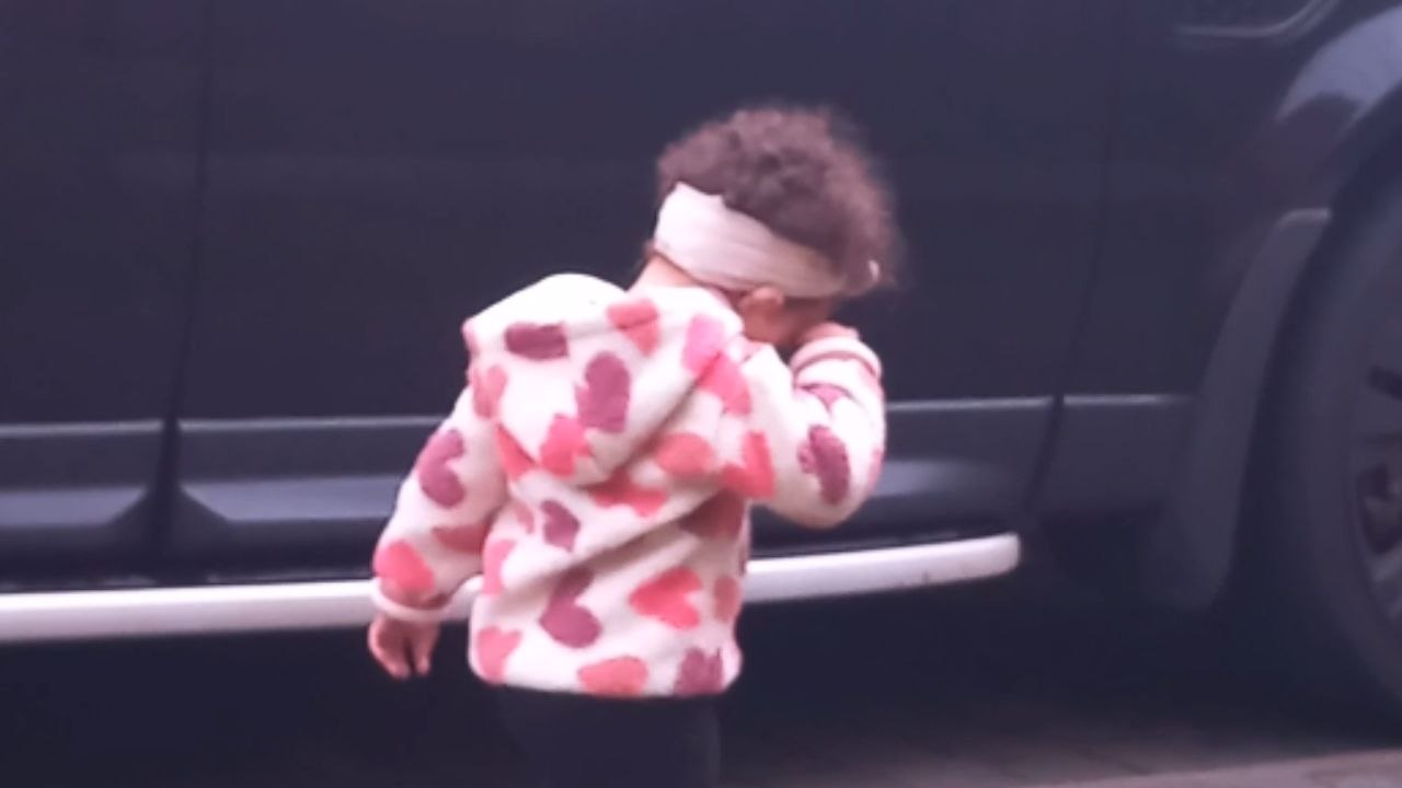 Toddler who wants to play outdoor is allured in...