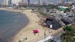 شاهد: إسرائيليون يستجمون على شاطئ تل أبيب يفرون للاحتماء على وقع دوي صفارات الإنذار