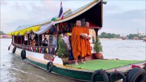 Tradition of giving alms by boat at Koh Kret Island In Thailand