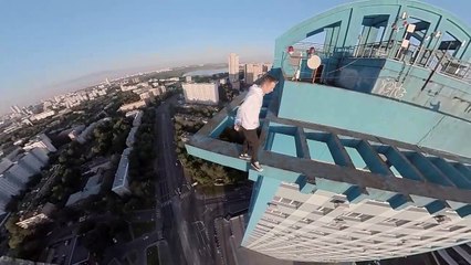 Daredevil Makes Precarious Dash Across  High-Rise Rooftop
