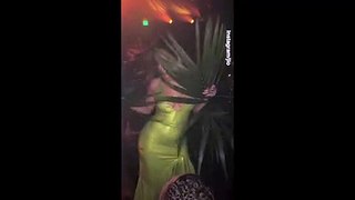 Jennifer Lopez sizzles in green dress as she dances with a plant