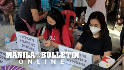 Voters' assistance desks help Caloocan residents locate their names and voting precinct