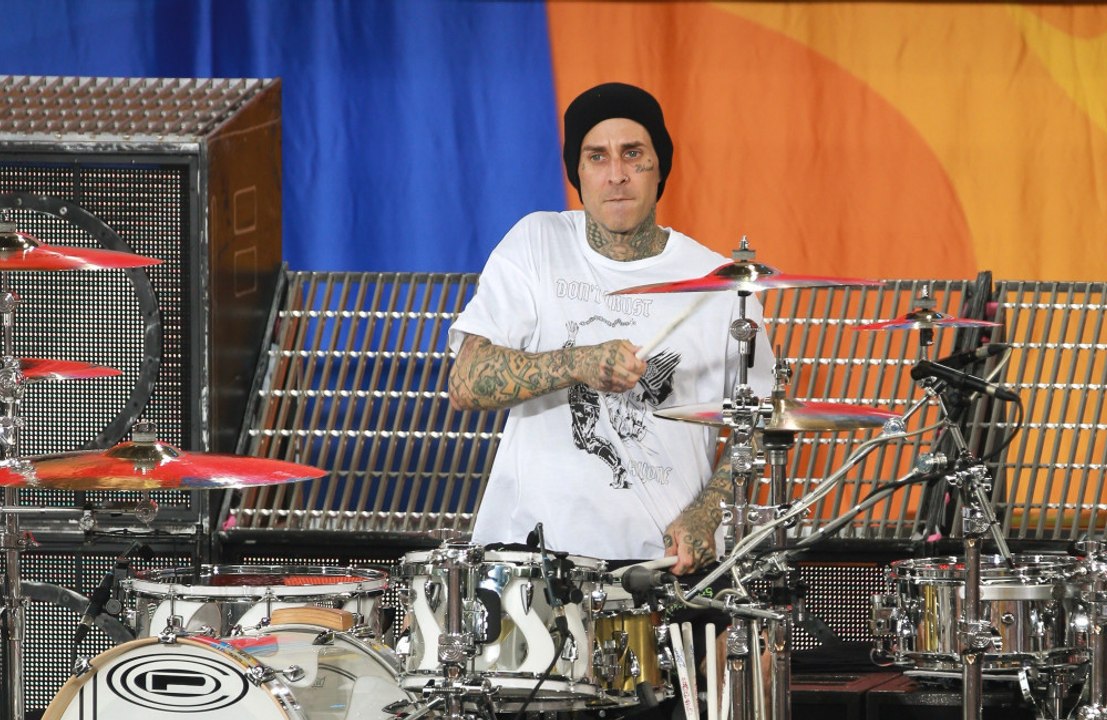 Travis Barker credits the "power of love" for getting him back on a plane
