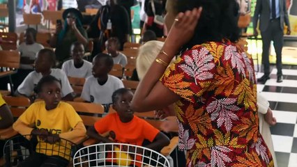Queen joins children for reading time at library in Kenya