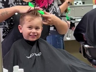 Son Practices His Best Blue Steel During Haircut