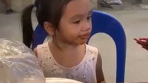 Little girl reacts hilariously to seeing the chicken feet BBQ for the first time