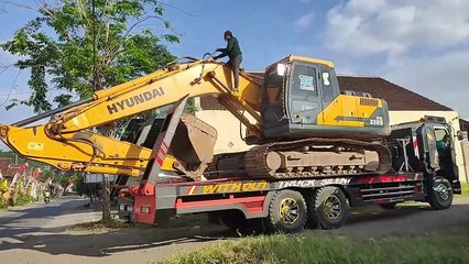Moment Excavator Landing in the Roads