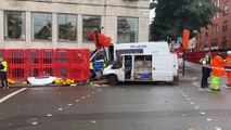 Pedestrian injured after police vehicle crashes into van in central London