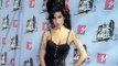 Amy Winehouse's dad Mitch is suing two of the late singer's friends