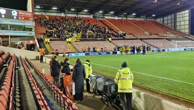 Horsham FC fans celebrate with the players following their heroic 3-3 away from home at Barnsley in the FA Cup
