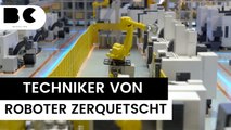 Industrie-Roboter zerquetscht Techniker