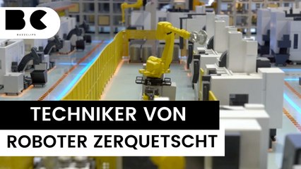 Industrie-Roboter zerquetscht Techniker