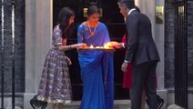 Rishi Sunak and his family light candles outside Downing Street for Diwali