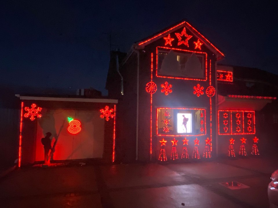 Couple spends £8k on a 12,000 bulb Remembrance light display