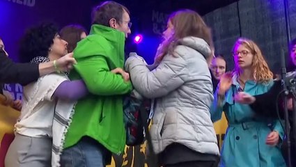 Man storms stage and snatches mic from Greta Thunberg as she speaks after Pro-Palestine chant in Amsterdam