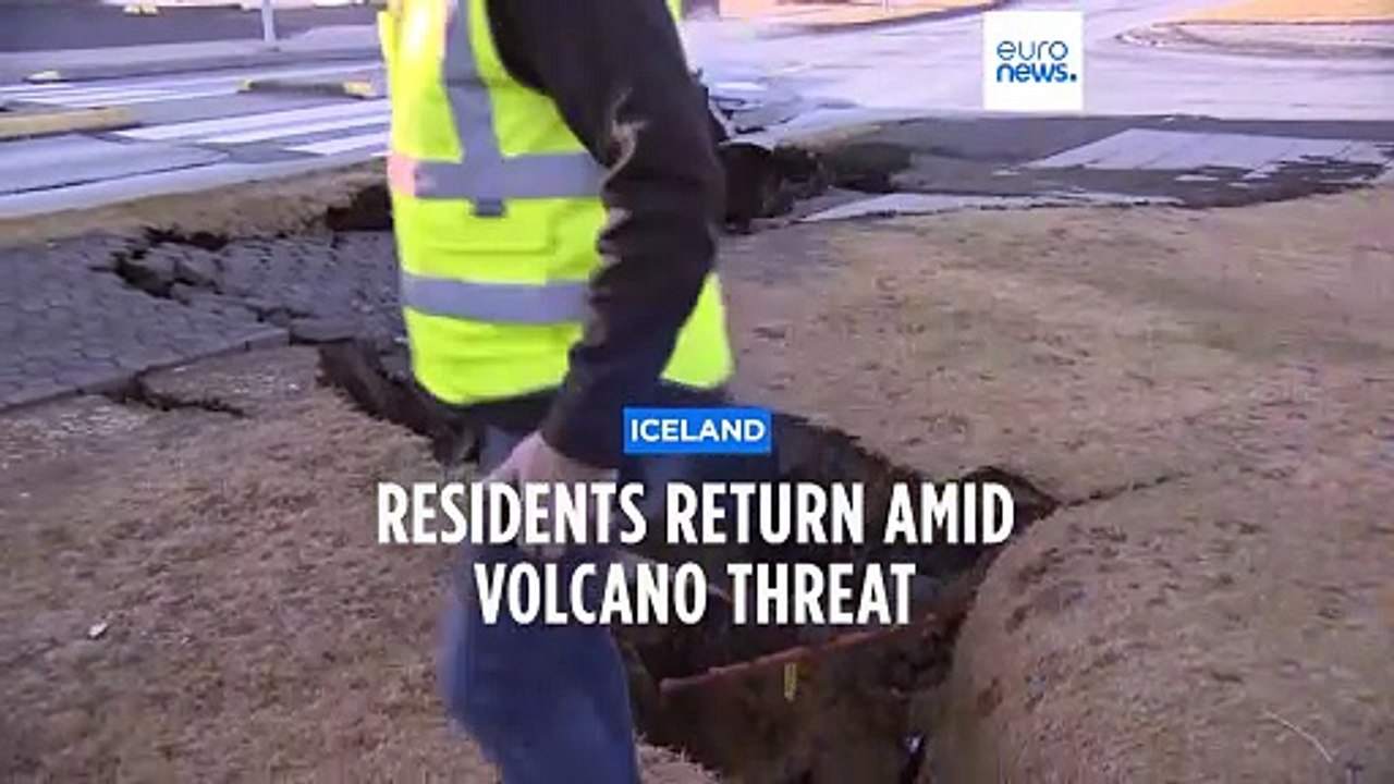 Fissures open up on the streets of an Iceland fishing town near a volcano that may soon erupt