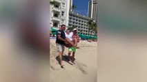 Beachgoers Carry Woman Who Uses Wheelchair Into Ocean | Happily TV