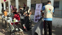 WATCH: Barbers give free haircuts to displaced Gazans in Rafah