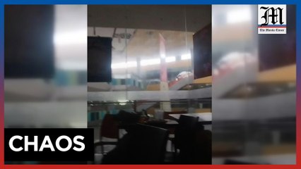 People take cover as a magnitude 6.8 quake hits Mindanao