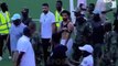 Mohamed Salah is escorted off by military officers and protected by his Egypt team-mates - as pitch invaders target Liverpool star during 2-0 win over Sierra Leone