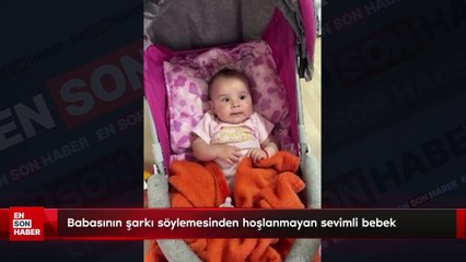 Babasının şarkı söylemesinden hoşlanmayan sevimli bebek