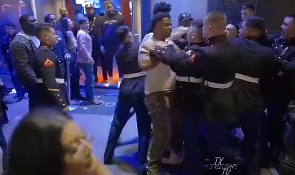Moment group of Marines get into massive brawl outside of Austin bar after a cell phone was taken from a woman - as Texas cops desperately try to break up the fight amid chants of 'USA! USA!'