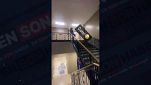 Merdivenlerden kestirmeden inmeye çalışan kadın