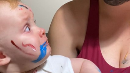 Adorable baby girl has her heart in her mouth after seeing paint on mummy's face