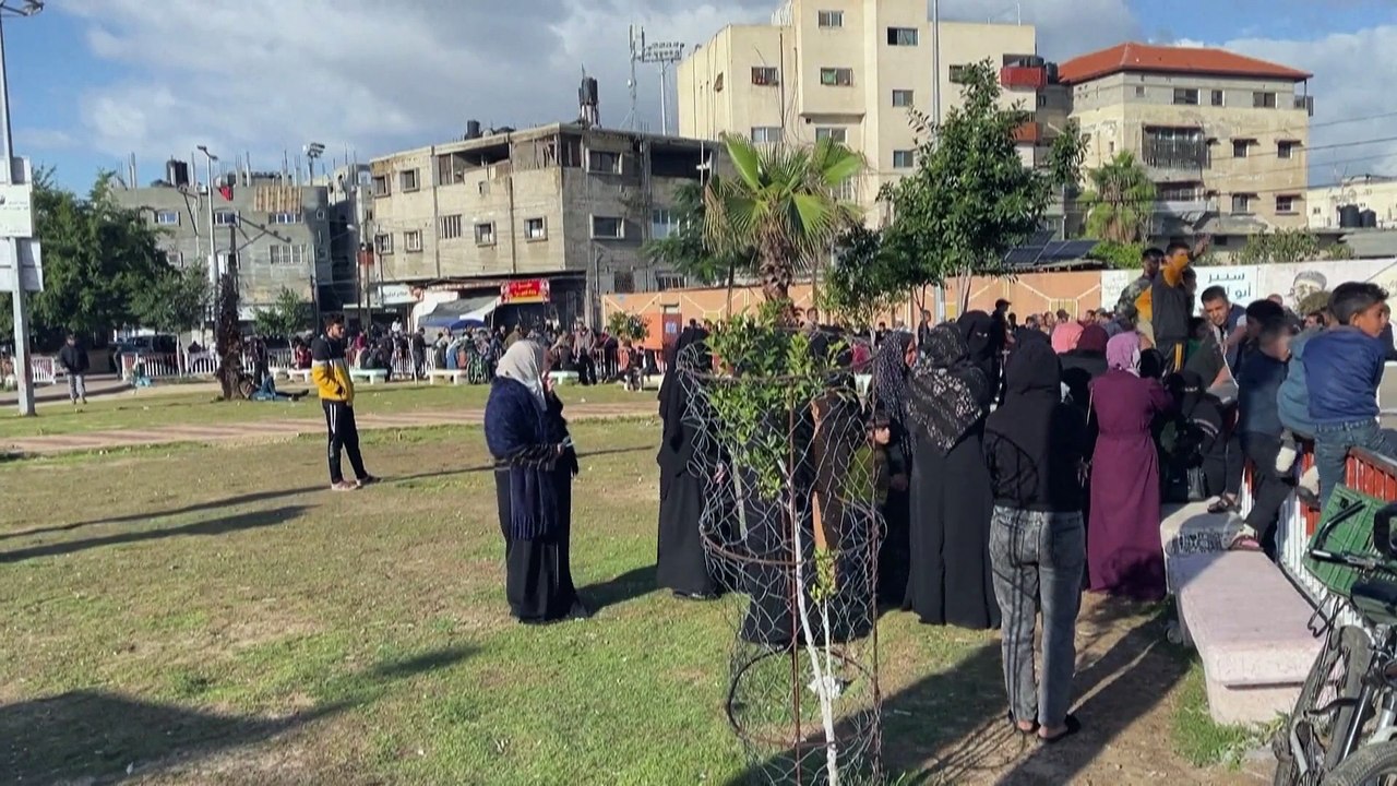 Watch: Residents and displaced Gazans receiving bags of flour at the UN Relief