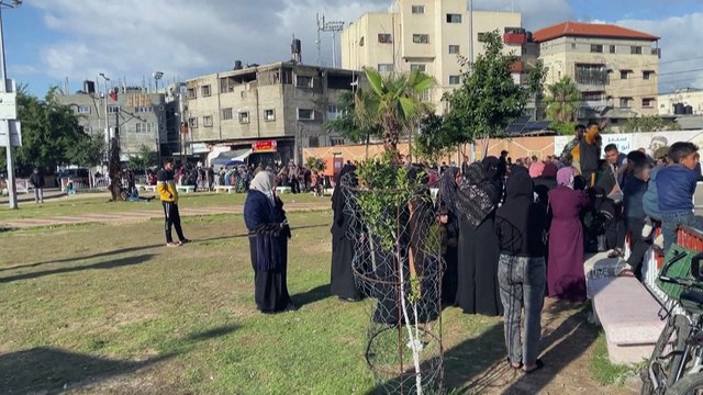 Watch: Residents and displaced Gazans receiving bags of flour at the UN Relief