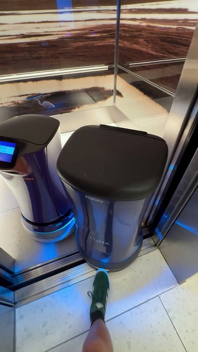 Polite Man Helps Confused Robots Exit Elevator