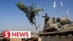 Israeli armoured vehicles move away as truce begins