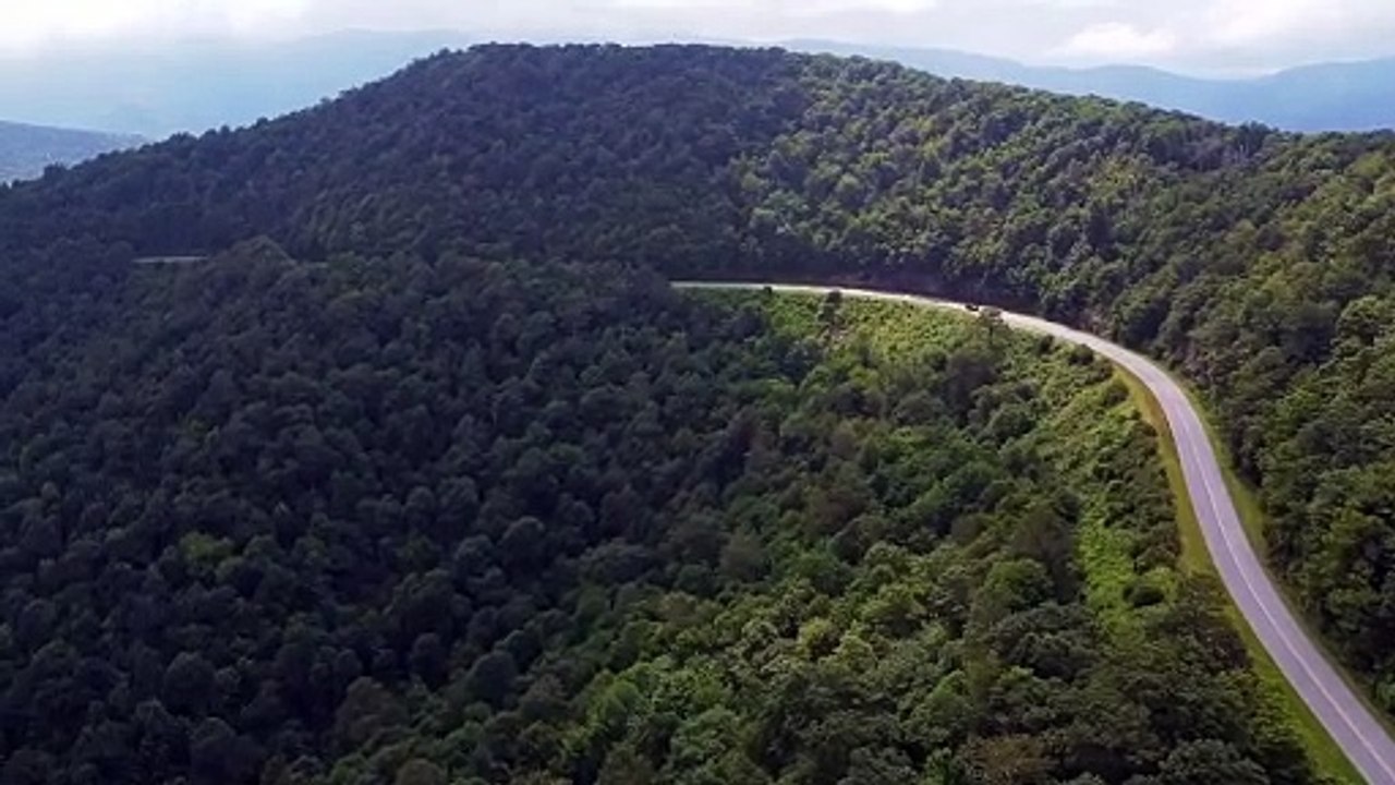 Aerial video Footage of car on Mountain road Stock video.