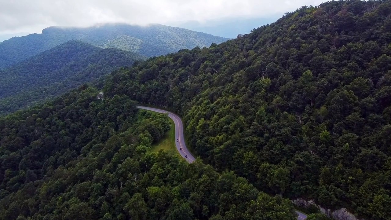 Aerial video Footage of car on Mountain road Stock video.