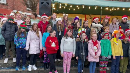 Children singing at Christmas Carol at Crediton's Lights Switch-On event 25.11.23 IMG_0866