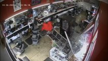 Customer dodges  truck crashing through barbershop window