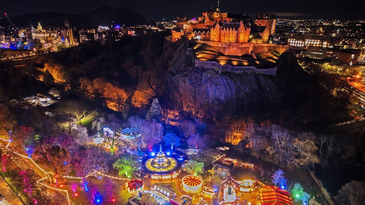Edinburgh Christmas market and castle lit up for festive season
