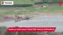 Yıkamak için baraja soktukları traktör akıntıya kapılarak suya saplandı