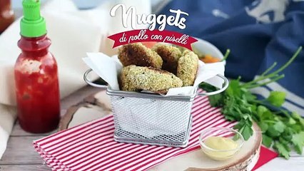 Nuggets di pollo con piselli e carote
