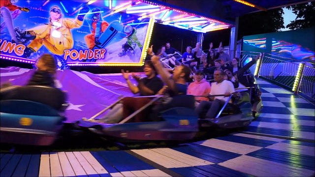 People Enjoying A Ride At The Carnival