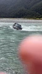SUV Gets Stuck in Rising River