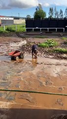 Boy Plays in Mud Puddle