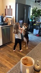 Girl Sweetly Serenades Dog