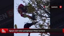 Samsun'da ağaçta asılı kalan paraşütçüyü itfaiye kurtardı
