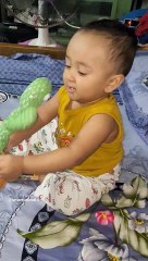 Baby playing with Talking Cactus