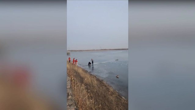 Bystanders crawl on frozen lake to save trapped teenagers in China