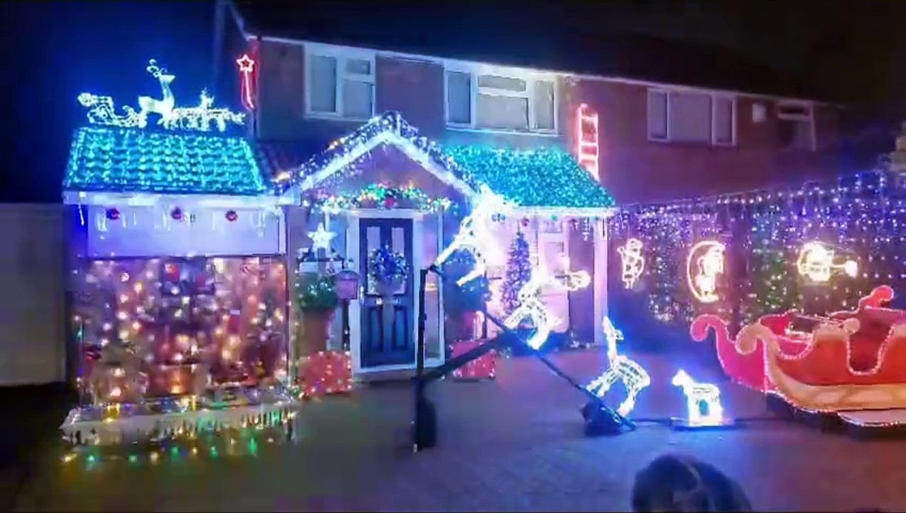 Watch the moment Luton family turns on incredible Christmas lights display for charity - with snow machine and life-sized Santa's sleigh