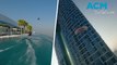 Wakeboarder performs stunt jumping off Dubai infinity pool