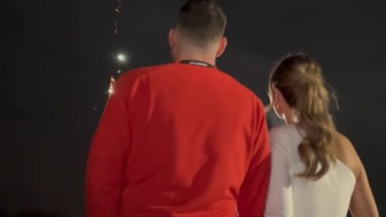 Excited couple embraced by elation in fire-tastic gender reveal moment