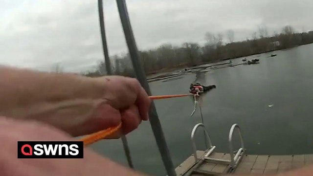 Police officer crawls across frozen lake to rescue two fishermen and a dog